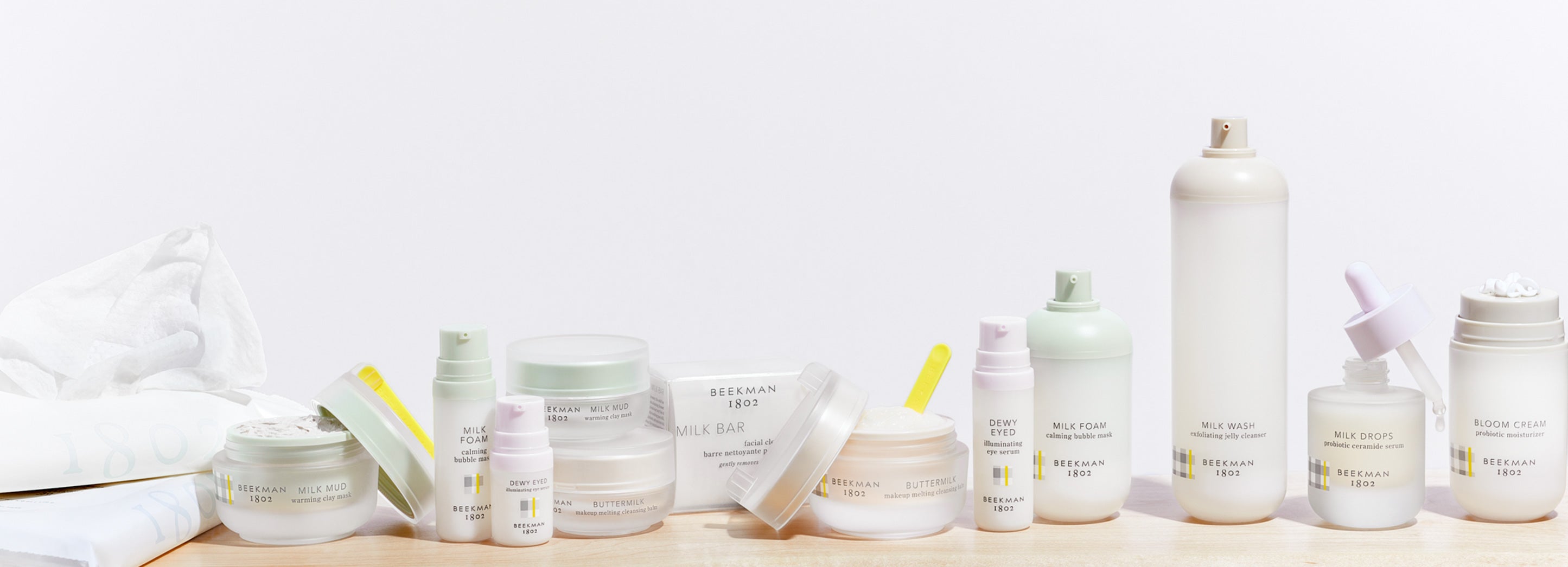 Variety of Beekman 1802 skincare products on shelf with white background 