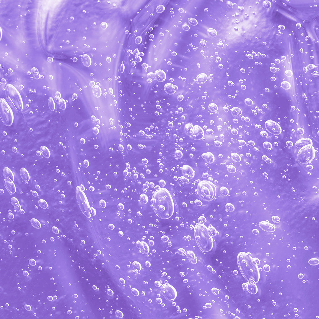 Up close shot of bubbles formed in the purple peptide ingredient drop. 