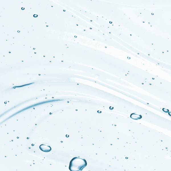 Close up shot of Glycolic acid ingredient that's used in Beekman 1802's Potato Peel in liquid form with bubbles in the substance.